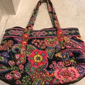 A Flowered Vera Bradley purse.